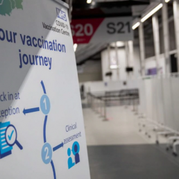 Sign in a clinic with information about Covid-19 vaccination programme