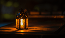 Lit lantern in darkness for Ramadan